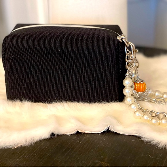 Dior black “CD” raised emblem silver & pearl wristlet & carriage keychain